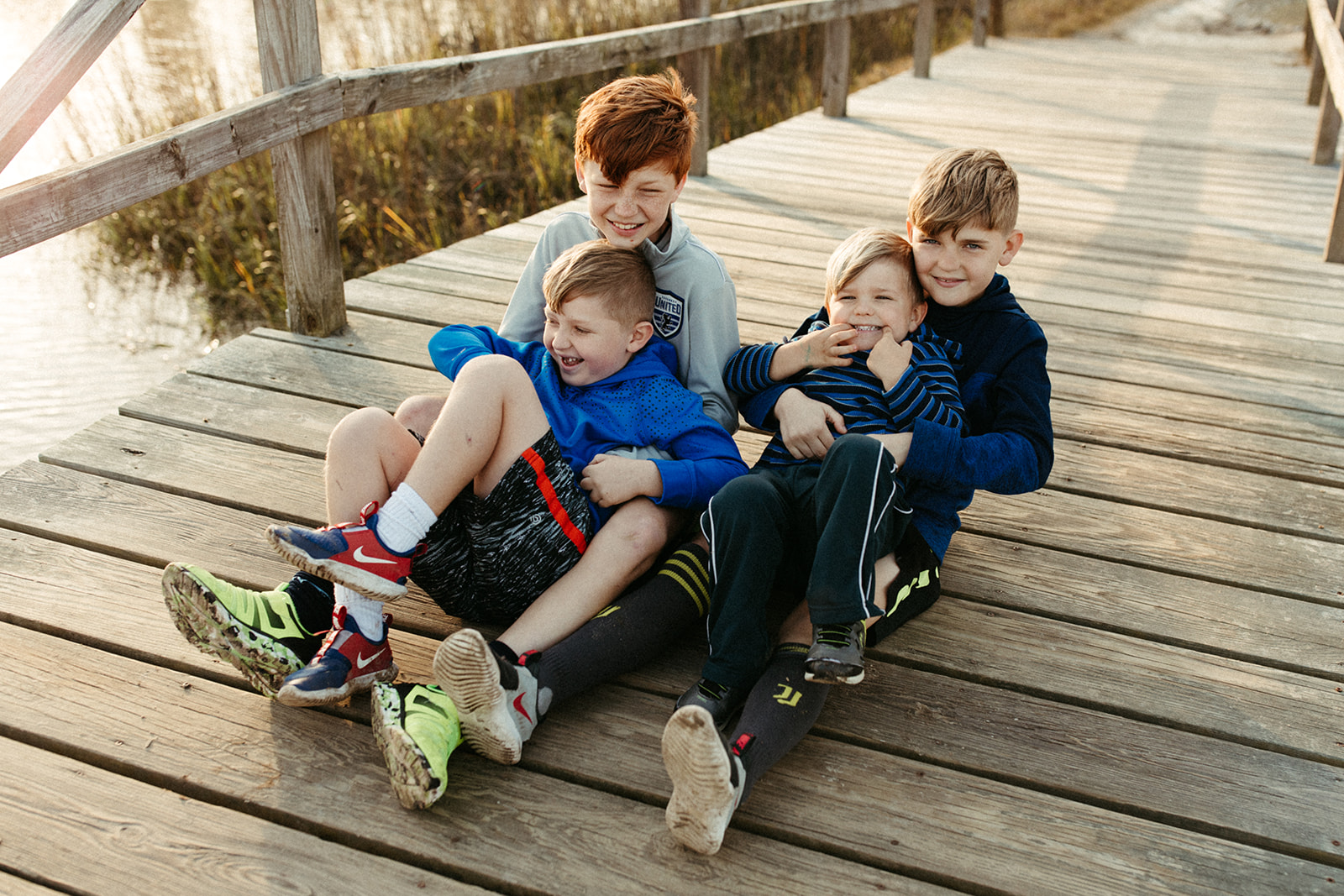 Brothers sit together while laughing in Savannah, Georgia