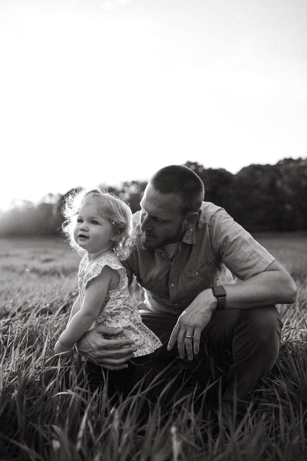 Father holds his young daughter outside of Minneapolis, Minnesota