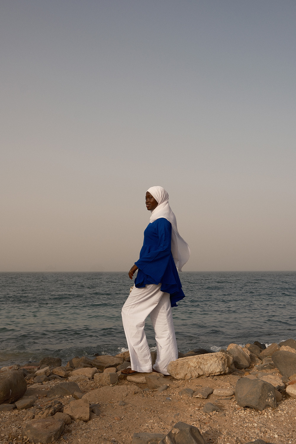 Wooden fishing pirogues sit on the shore of Oakam, Senegal