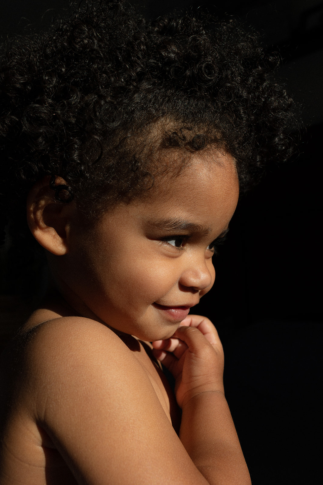 Motherhood, Newborn, Family, Portrait, Humanitarian Photographer Lauren Neal Photographer A toddler-aged girl looks at her mom in Albuquerque, New Mexico