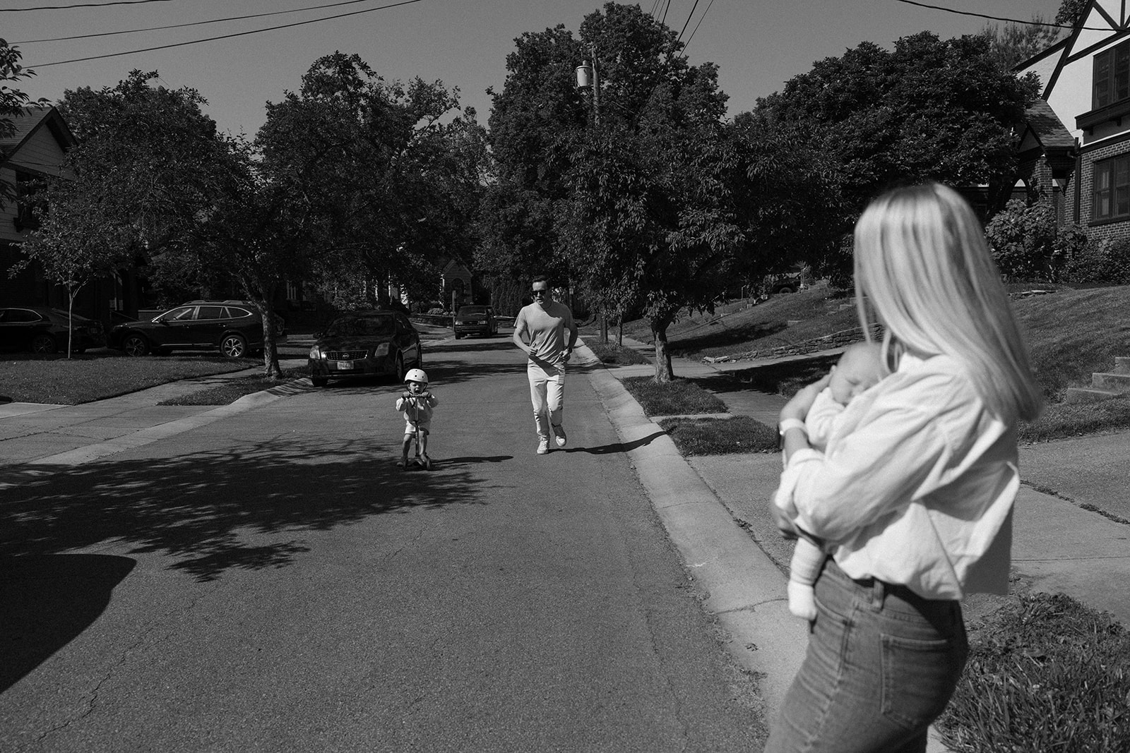Family, Portrait, Humanitarian Photographer Lauren Neal Photographer A young family plays outside in front of their home in Cincinnati, Ohio.