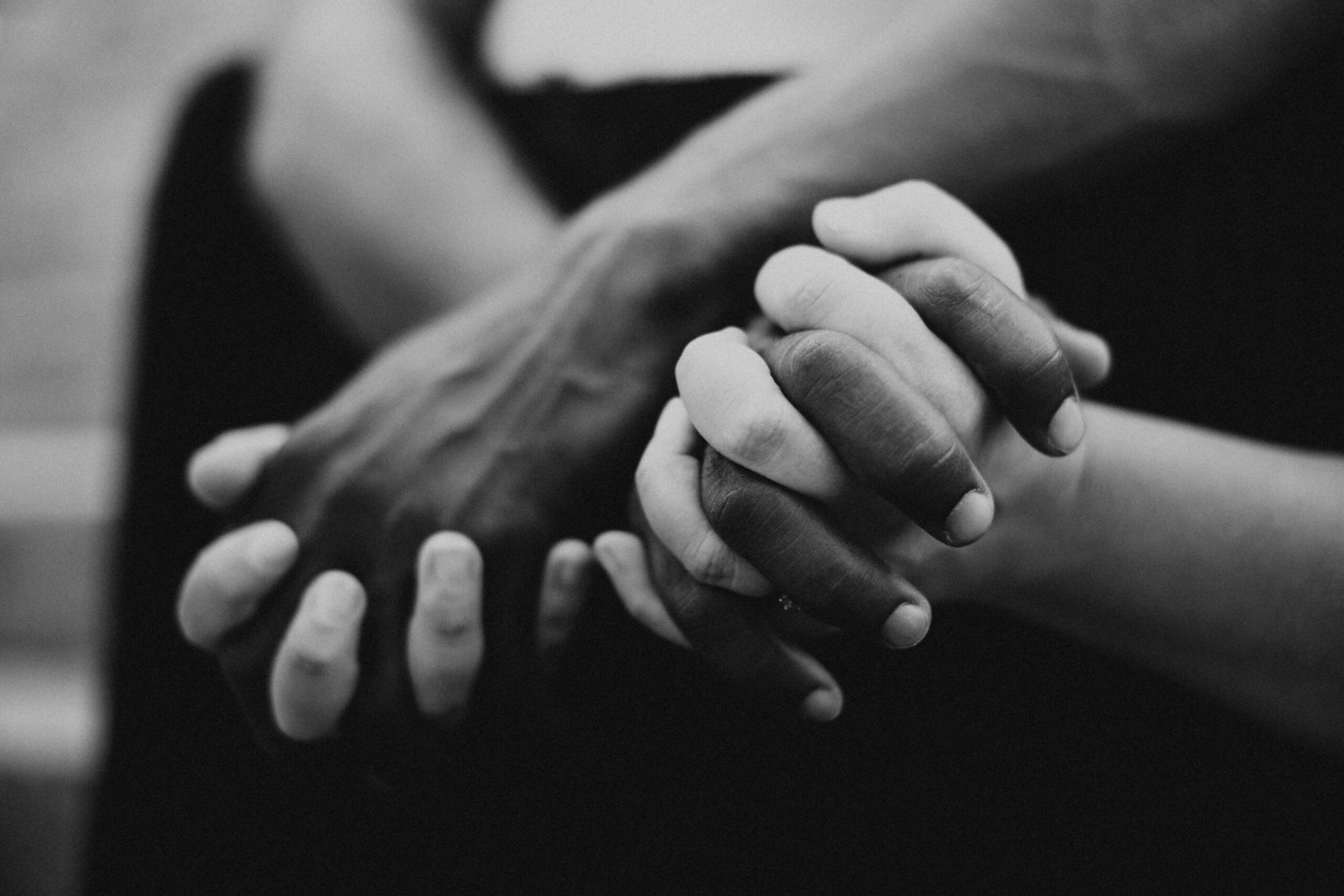 Family and Motherhood Photographer Lauren Neal Photography Mixed couple holds hands in Port-au-Prince, Haiti