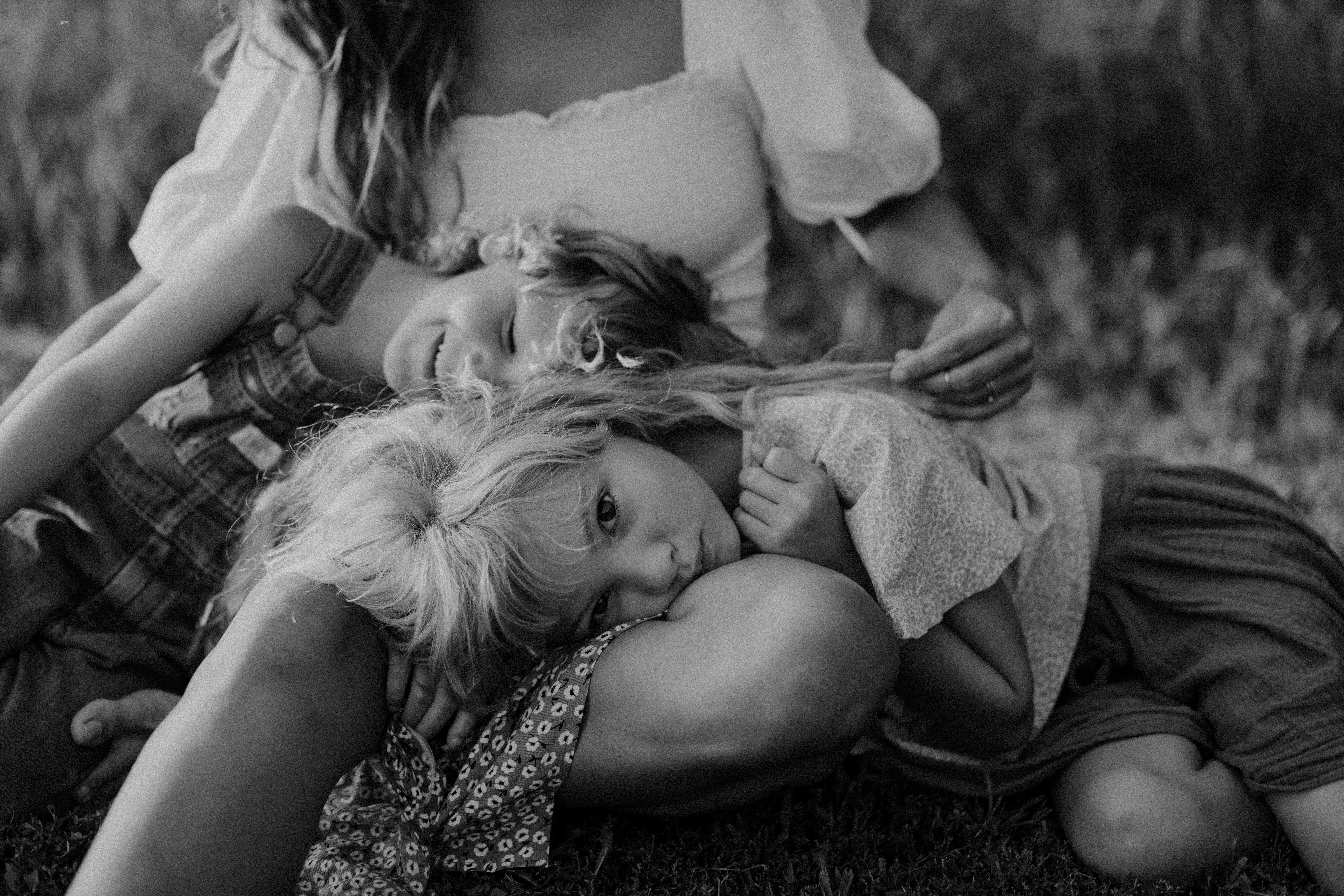 Two children lay on their mother's lap in Cincinnati, Ohio