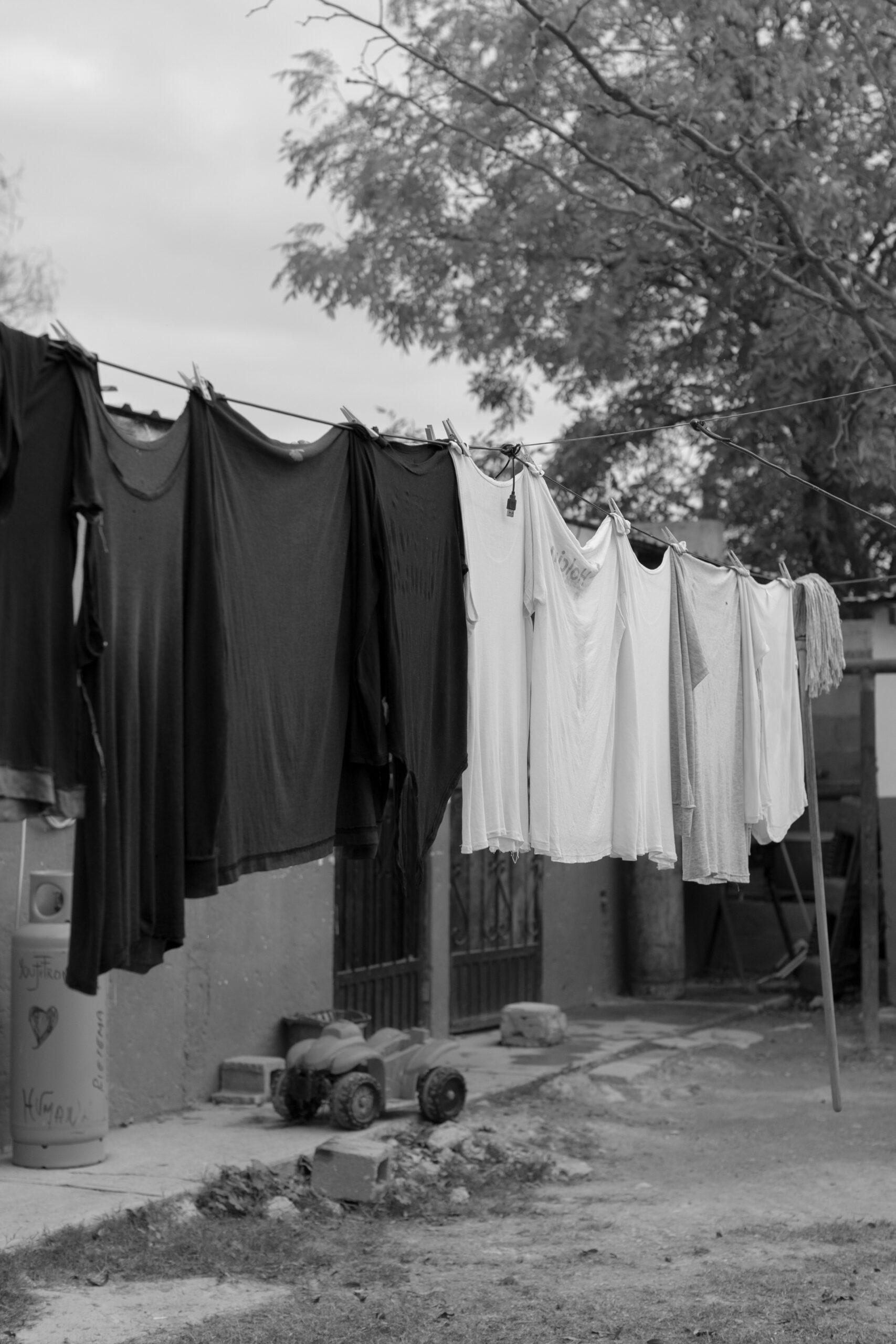 Clothes hang to dry on a clotheslines in the yard of a migrant home in Acuña, Mexico
