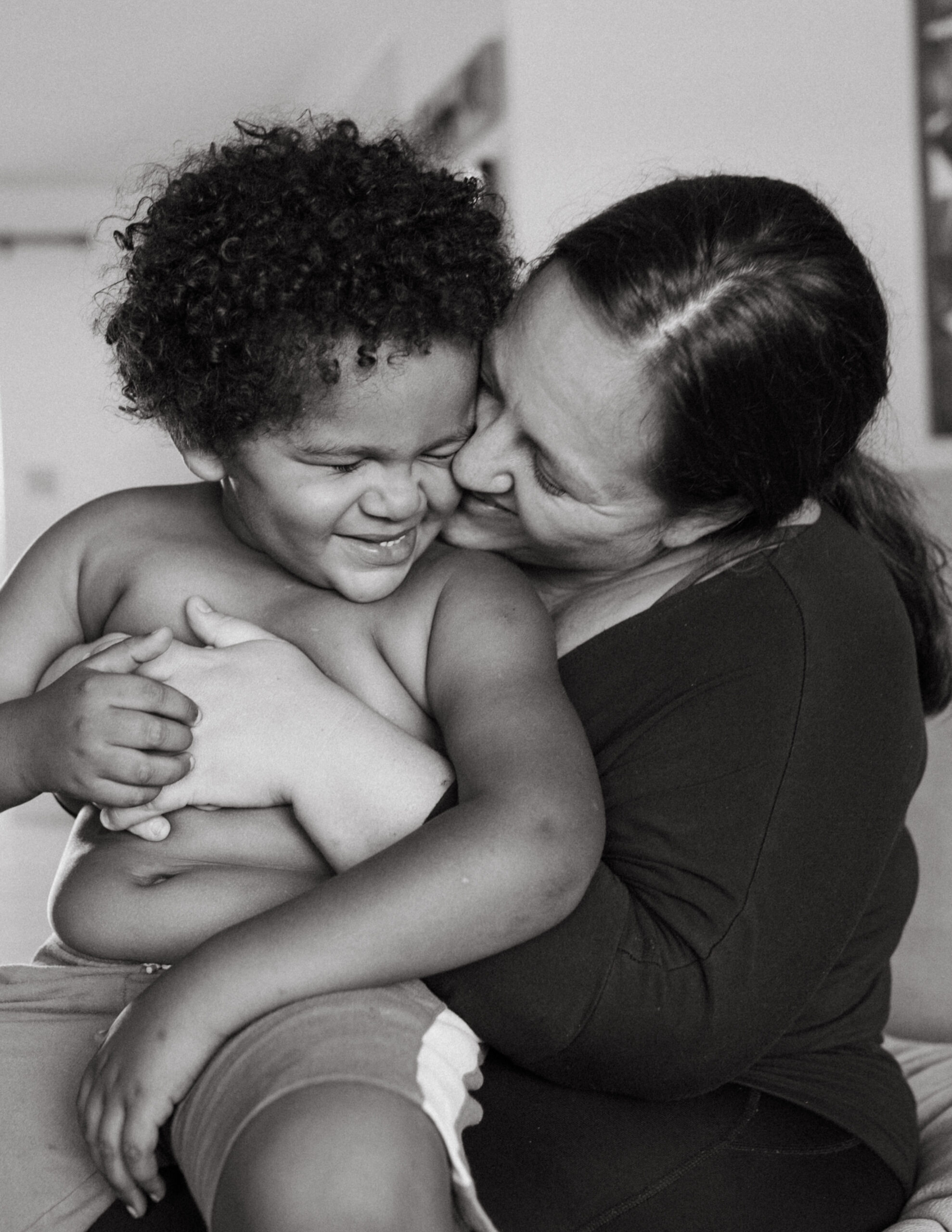 Black and white photo of mom holding her son